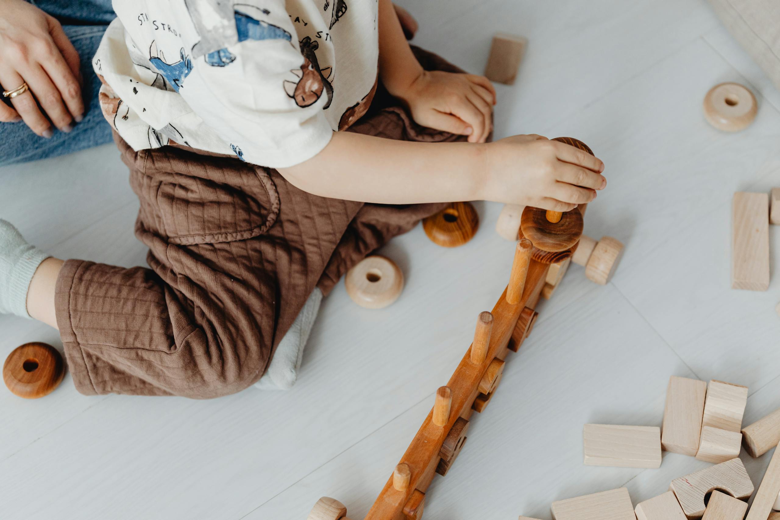 Child Playing with Toy Blocks