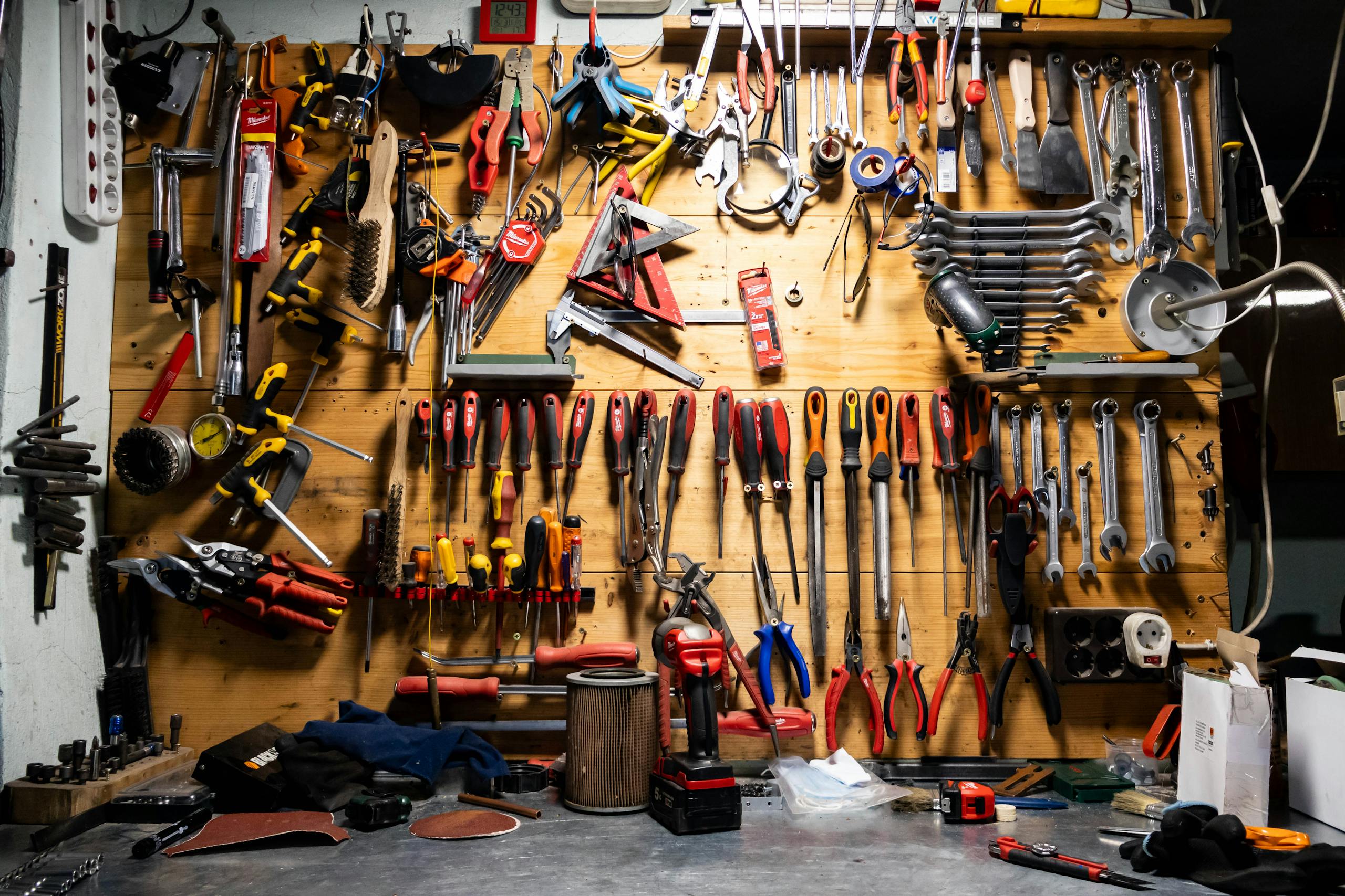 glasses and a lot of mechanical equipment hanging on the wall in a basement